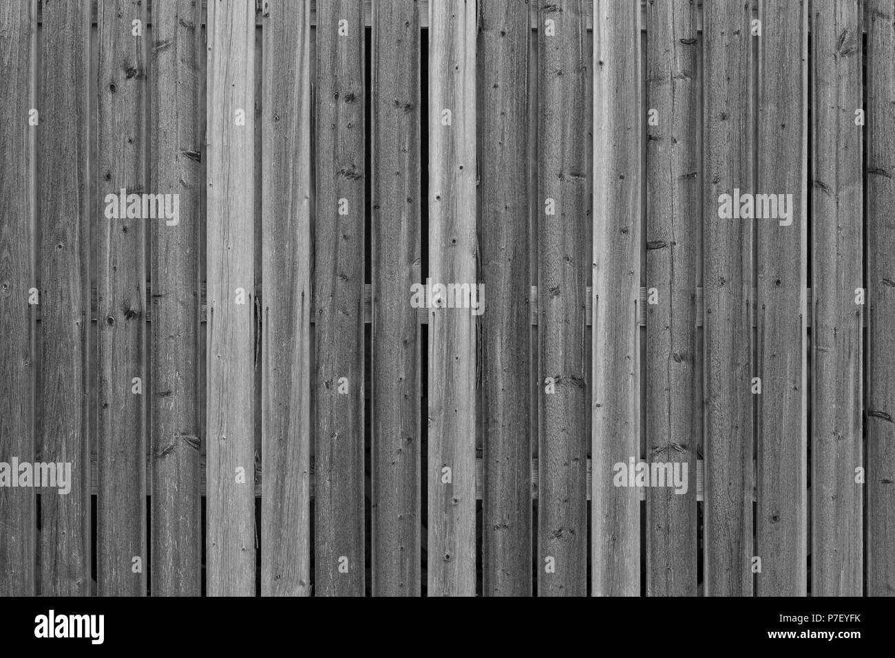 Full frame background of an unpainted wood board wall in black and white Stock Photo