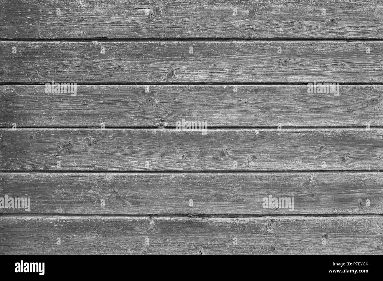 Full frame background of an old and faded wood board wall in black and white Stock Photo