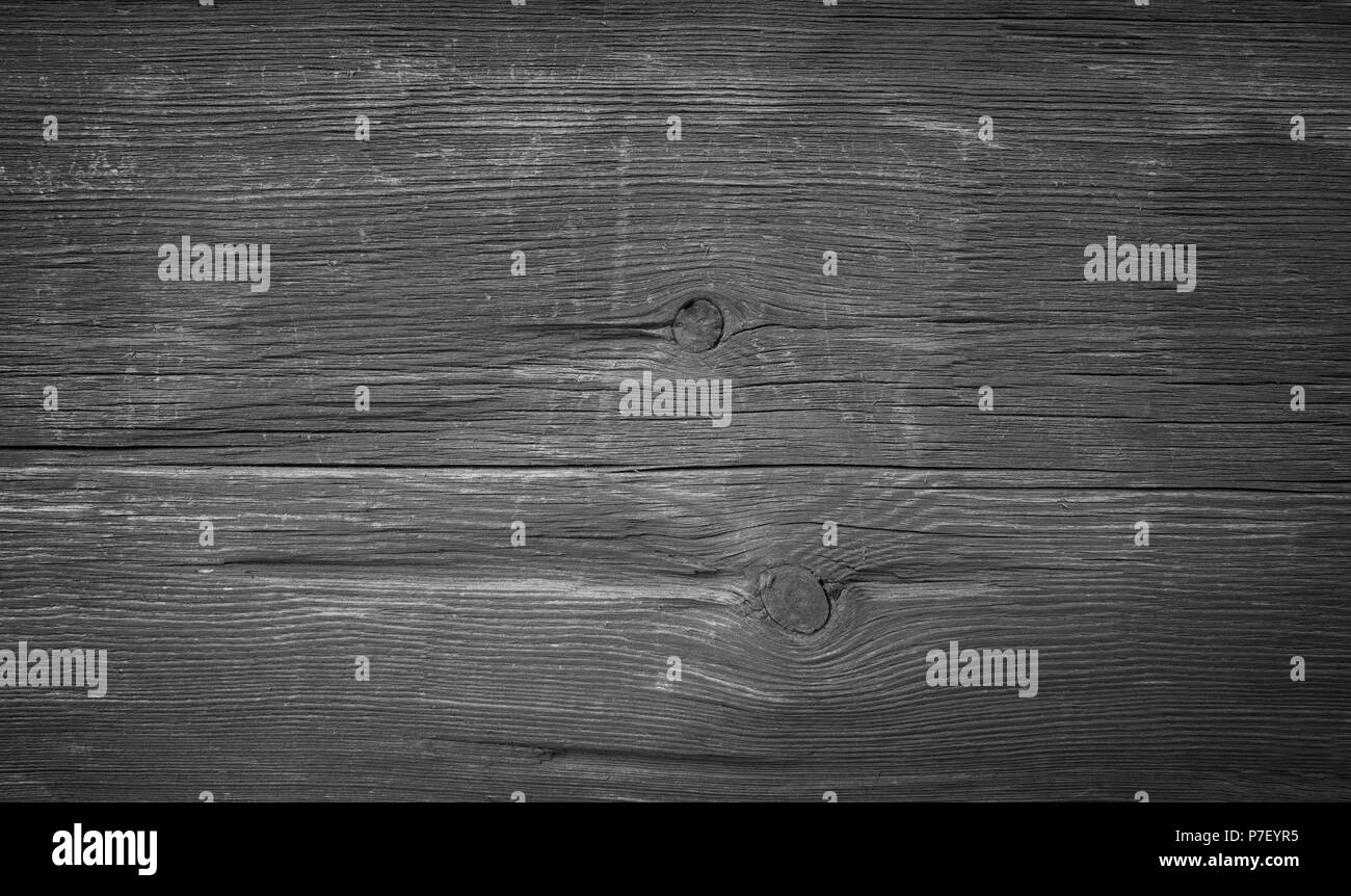 Close-up of an old and faded wood board wall texture background in black and white with vignette Stock Photo