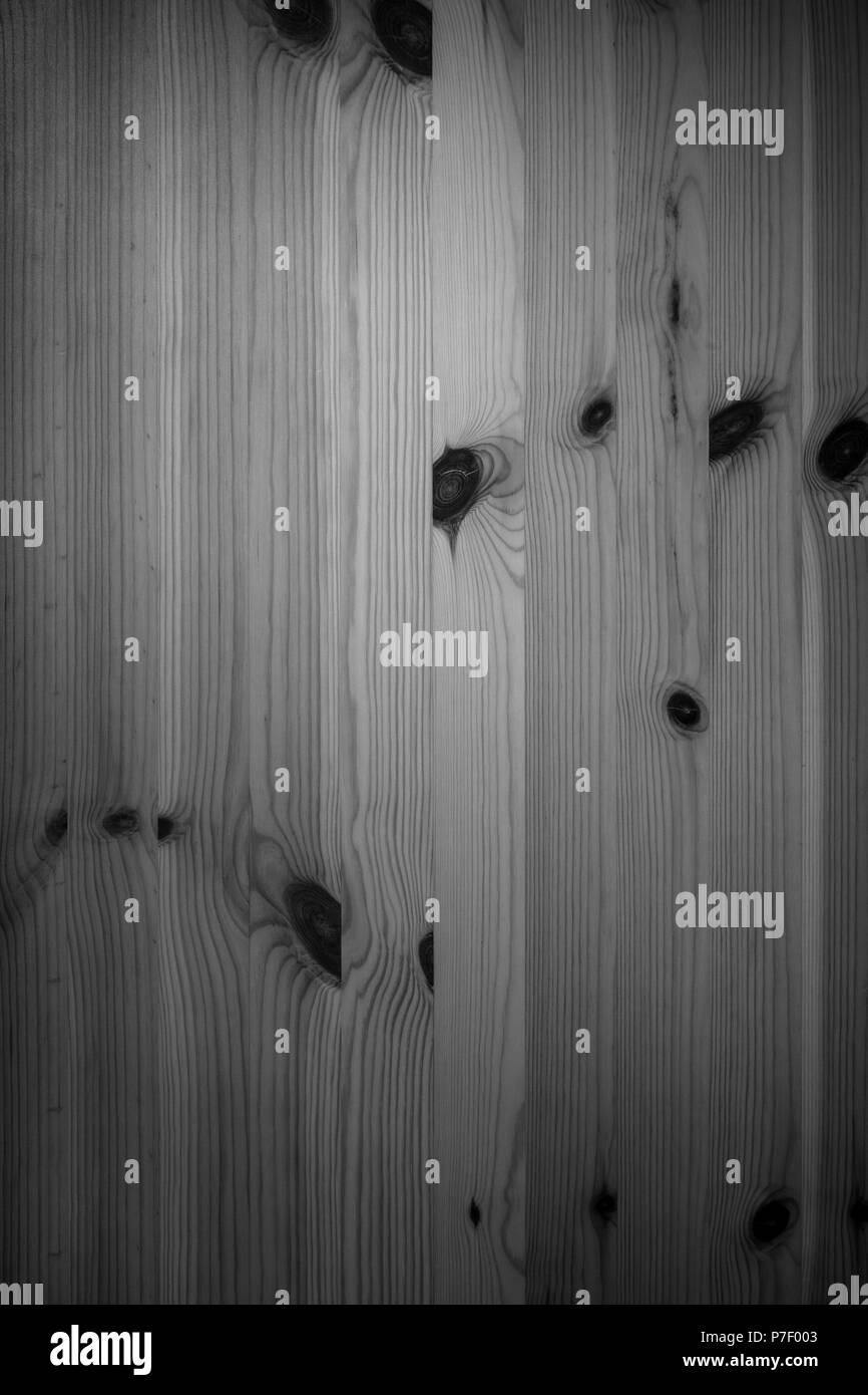 Full frame background of an unpainted wood board wall in closet in black and white with vignetting Stock Photo