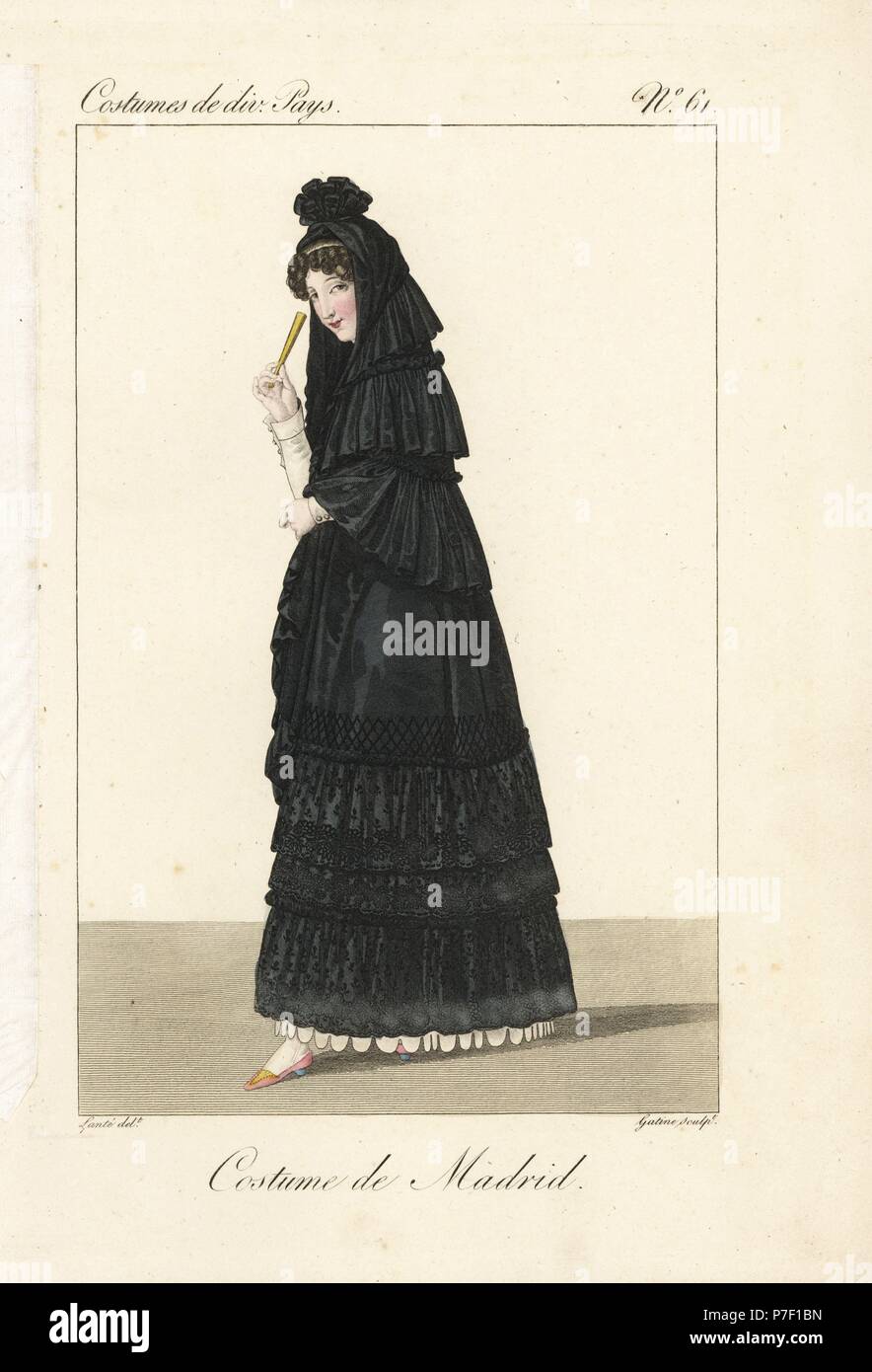 Woman of Madrid, Spain, 19th century. She wears the traditional black mantilla veil and basquina dress over a white petticoat and carries a fan. Handcoloured copperplate engraving by Georges Jacques Gatine after an illustration by Louis Marie Lante from Costumes of Various Countries, Costumes de Divers Pays, Paris, 1827. Stock Photo