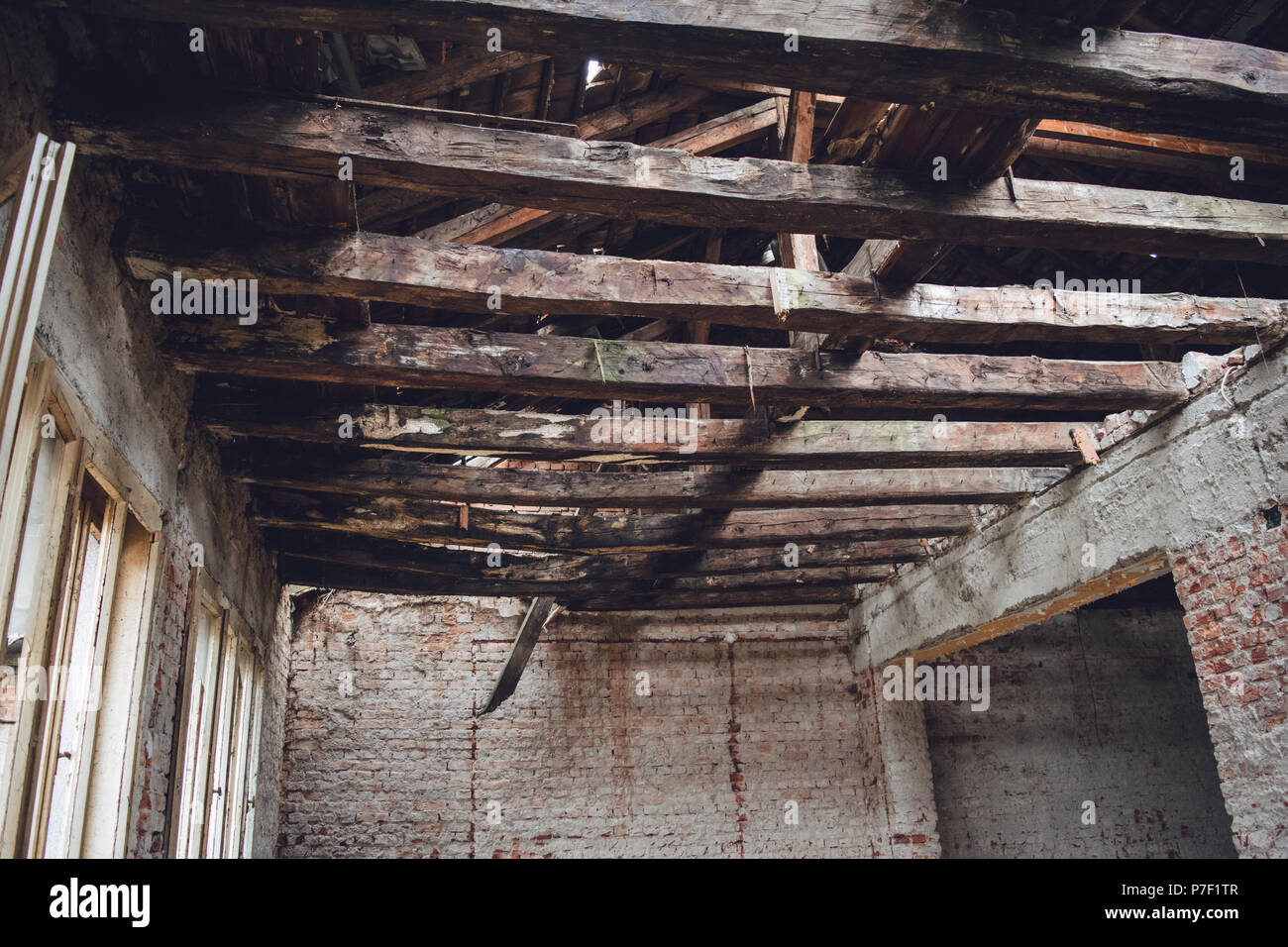 Wooden beam structure in the abandoned object. Stock Photo