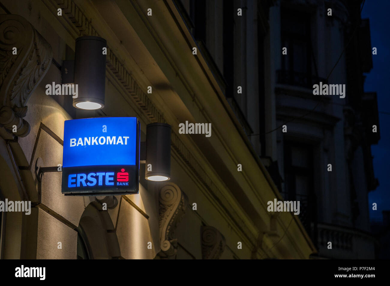BELGRADE, SERBIA - JUNE 28, 2018: Logo of Erste Bank at night on its main office in Belgrade, indicating the presence of an ATM, or Bankomat. Erste is Stock Photo