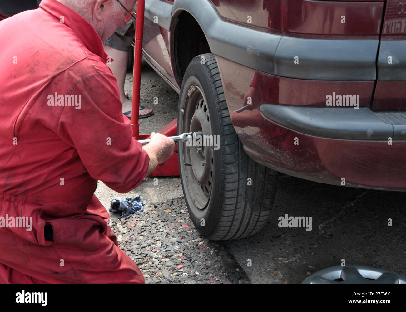 a MOTOR mechanic working on AND FIXING cars in north WEST London, UK