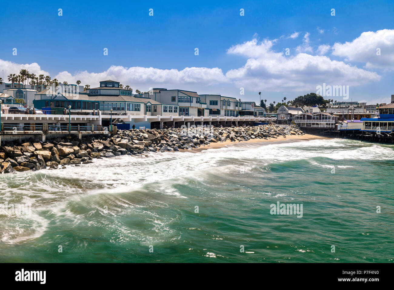 The Redondo Beach boardwalk in Southern California is lined with restaurants, housing and a nice beach. Stock Photo