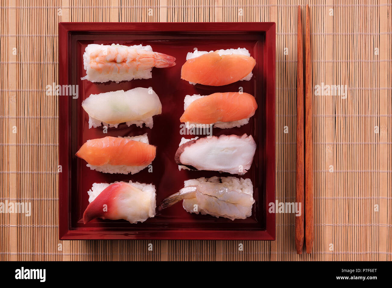 Sushi japanese food red tray chopsticks Stock Photo Alamy