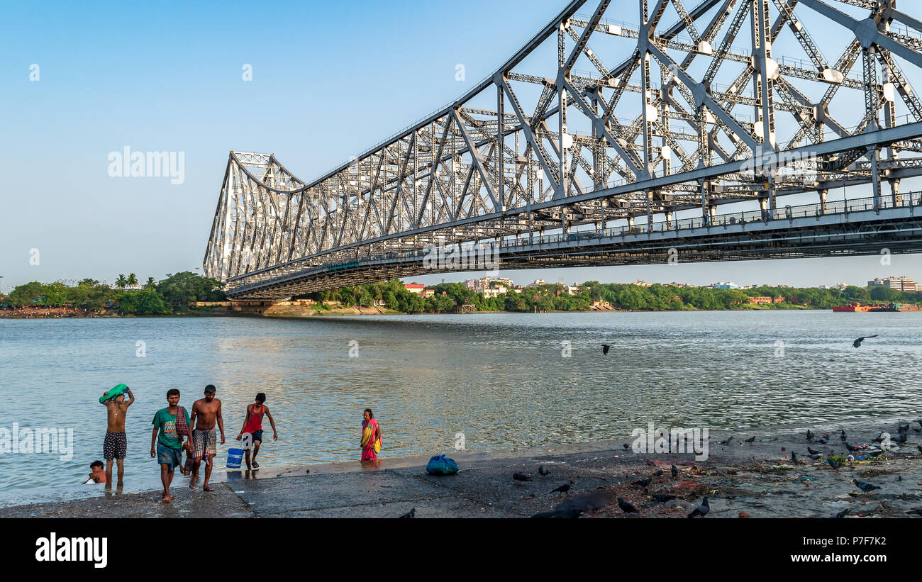 May 27,2018. Kolkata,India. People doing Morning activities on the Bank of Hooghly River overlooking The Howrah Bridge . Stock Photo