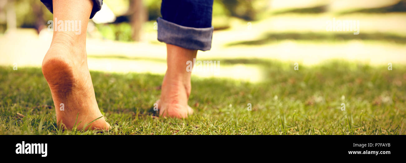 Woman barefoot close up grass hi-res stock photography and images - Alamy