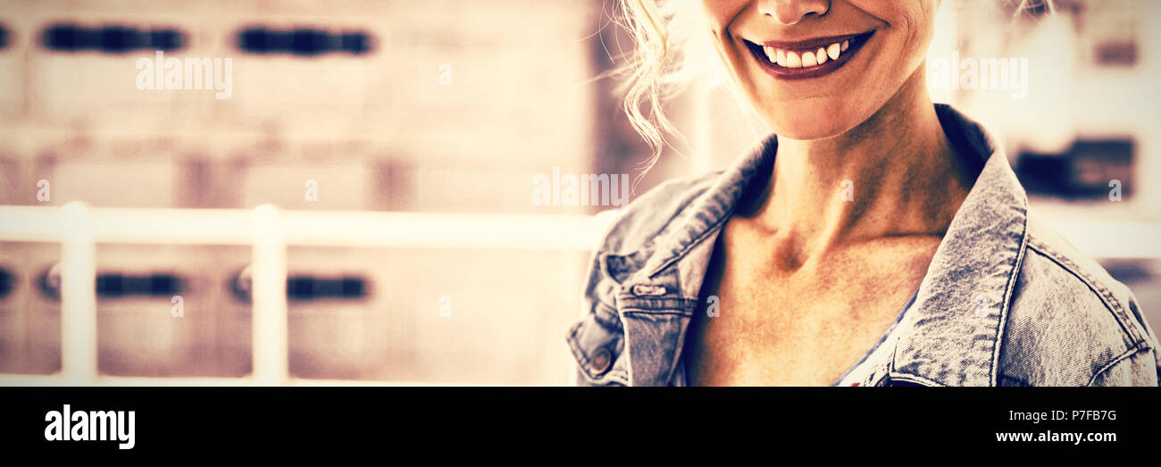 Pretty blonde designer smiling at camera Stock Photo