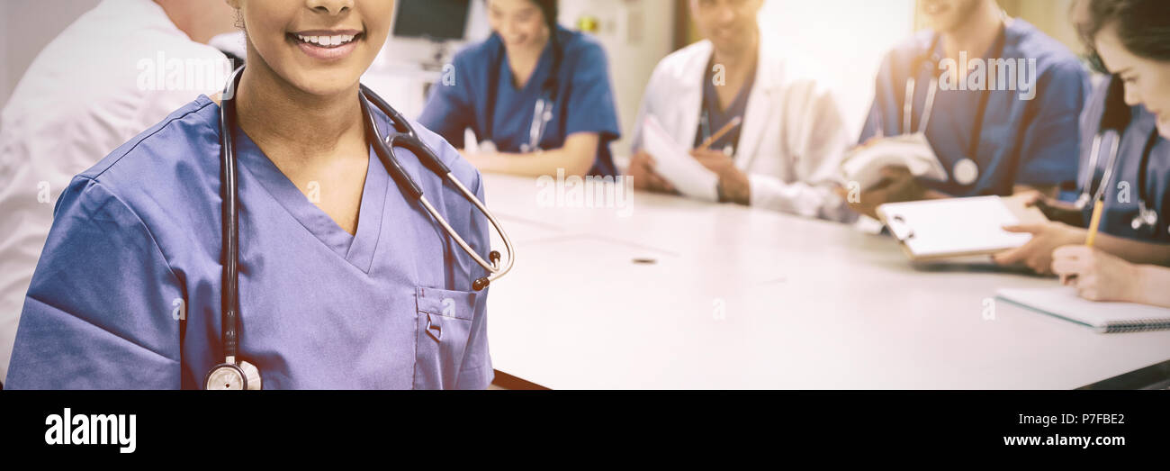 Medical student smiling at the camera during class Stock Photo