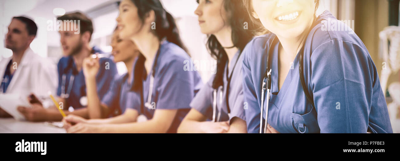 Student smiling at camera during class Stock Photo