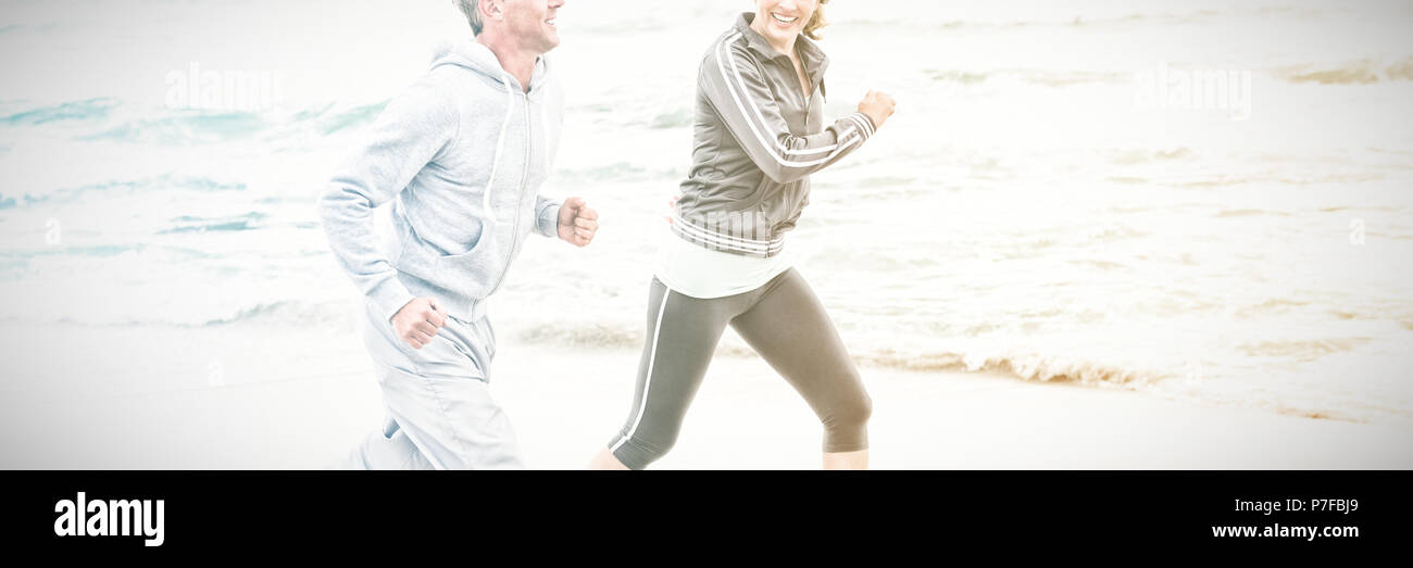 Fit couple jogging together Stock Photo