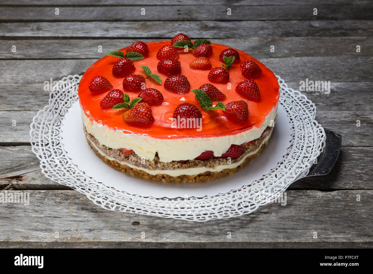 Strawberry cream cheese pie on gray wooden background. Stock Photo