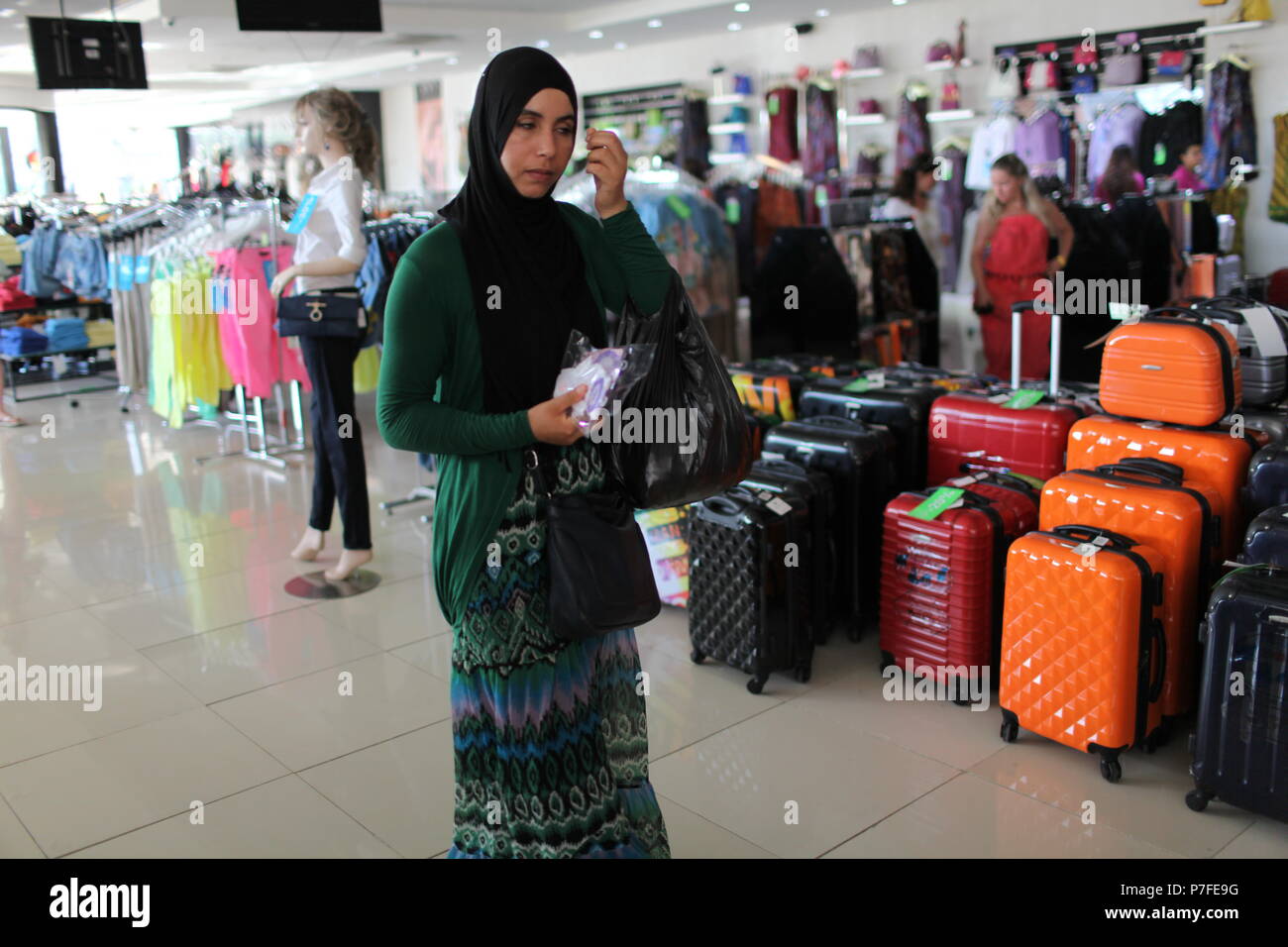 Young muslim lady in hijab shopping in department store in Hammamet, popular tourist destination in Tunisia Stock Photo