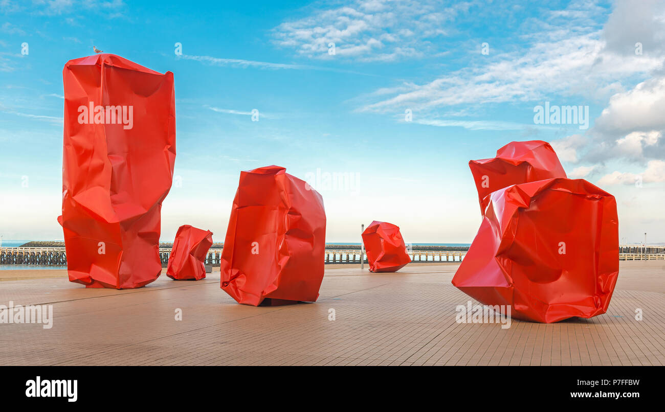 The public artwork of the Rock Strangers on the waterfront of Ostend during a sunny day in summer, West Flanders, Belgium. Stock Photo