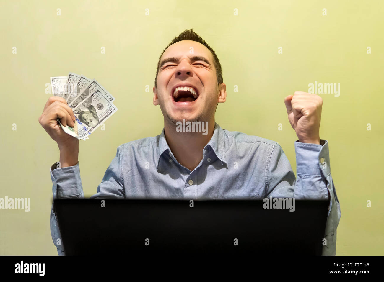 Modern young man cheering win hi-res stock photography and images - Alamy