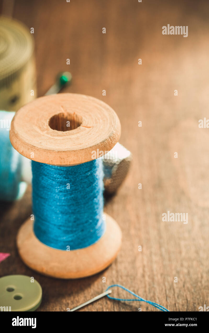 sewing tools and accessories on wooden table Stock Photo