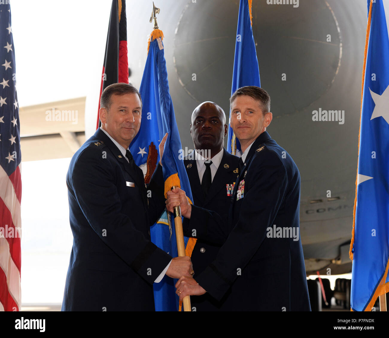 U.S. Air Force Maj. Gen. Christopher J. Bence, commander of the U.S. Air Force Expeditionary Center, passes the guidon and command of the 521st Air Mobility Operations Wing to Col. Bradley L. Spears in a ceremony June 28, 2018. The 521st AMOW provides forward-deployed command and control, aerial port, and aircraft maintenance support to DoD organic and contracted commercial aircraft executing airlift and air refueling missions throughout the U.S. Air Forces in Europe - Air Forces Africa area of responsibility. (U.S. Air Force photo by Airman 1st Class Ariel Leighty) Stock Photo