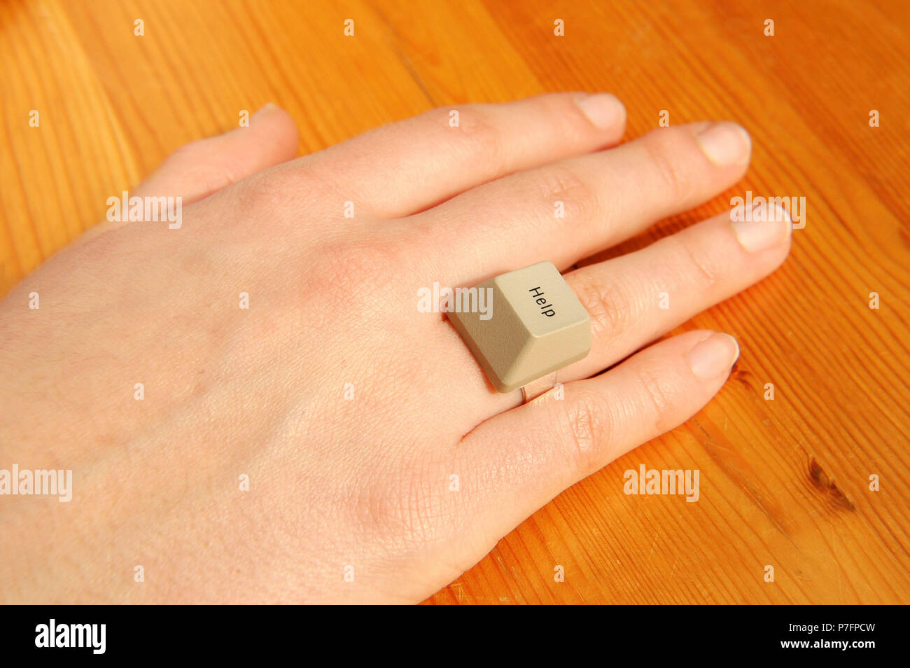 Needy, Hand with Help Ring from the computer keyboard, Germany Stock Photo