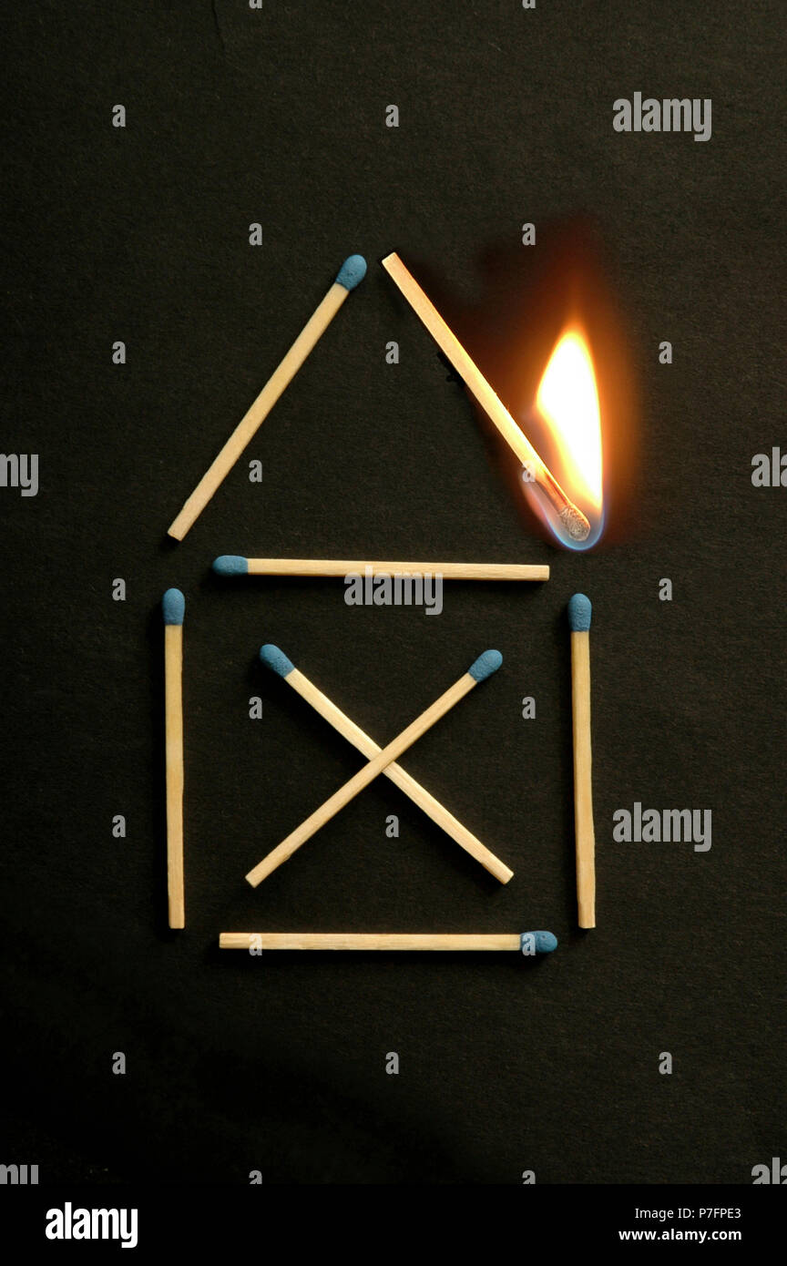 House symbol of matches with a burning match Stock Photo Alamy