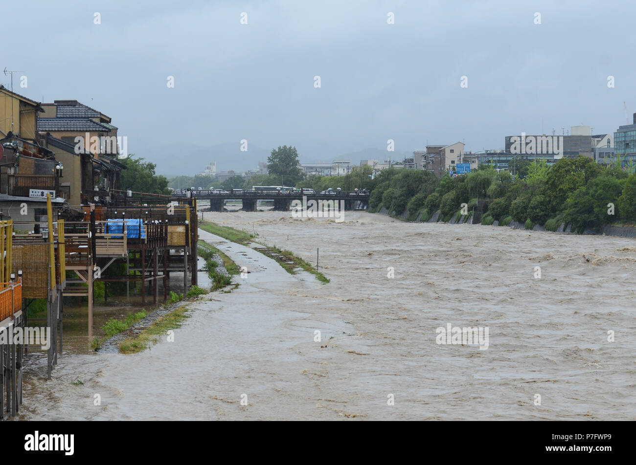 Kyoto, Japan. 6th July, 2018. Kyoto's main river, the Kamogawa, burst its banks, sending water over walkways usually busy with tourists and residents. Stock Photo