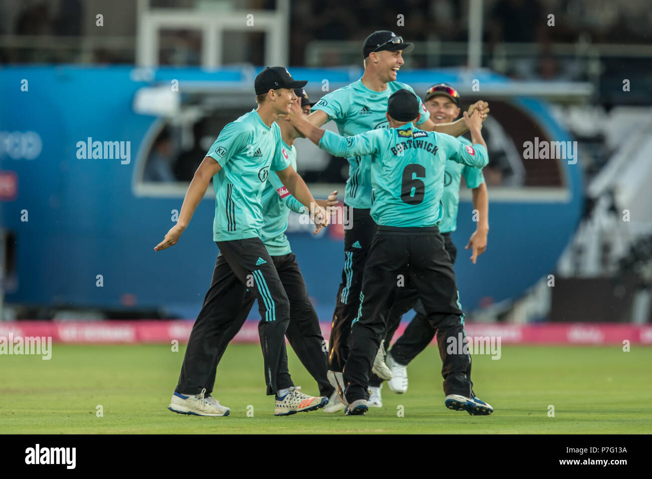 London, UK. 5 July, 2018.  The Surrey team celebrate ( L-R: Jamie Smith, Rory Burns [partly hidden] Will Jacks [jumping], Scott Borthwick and Sam Curran) after Will Jacks holds on to a low catch on the boundary and Eskinazi  is out off the bowling of Morne Morkel. Middlesex v Surrey in the Vitality Blast T20 cricket match at Lords. David Rowe/Alamy Live News Stock Photo