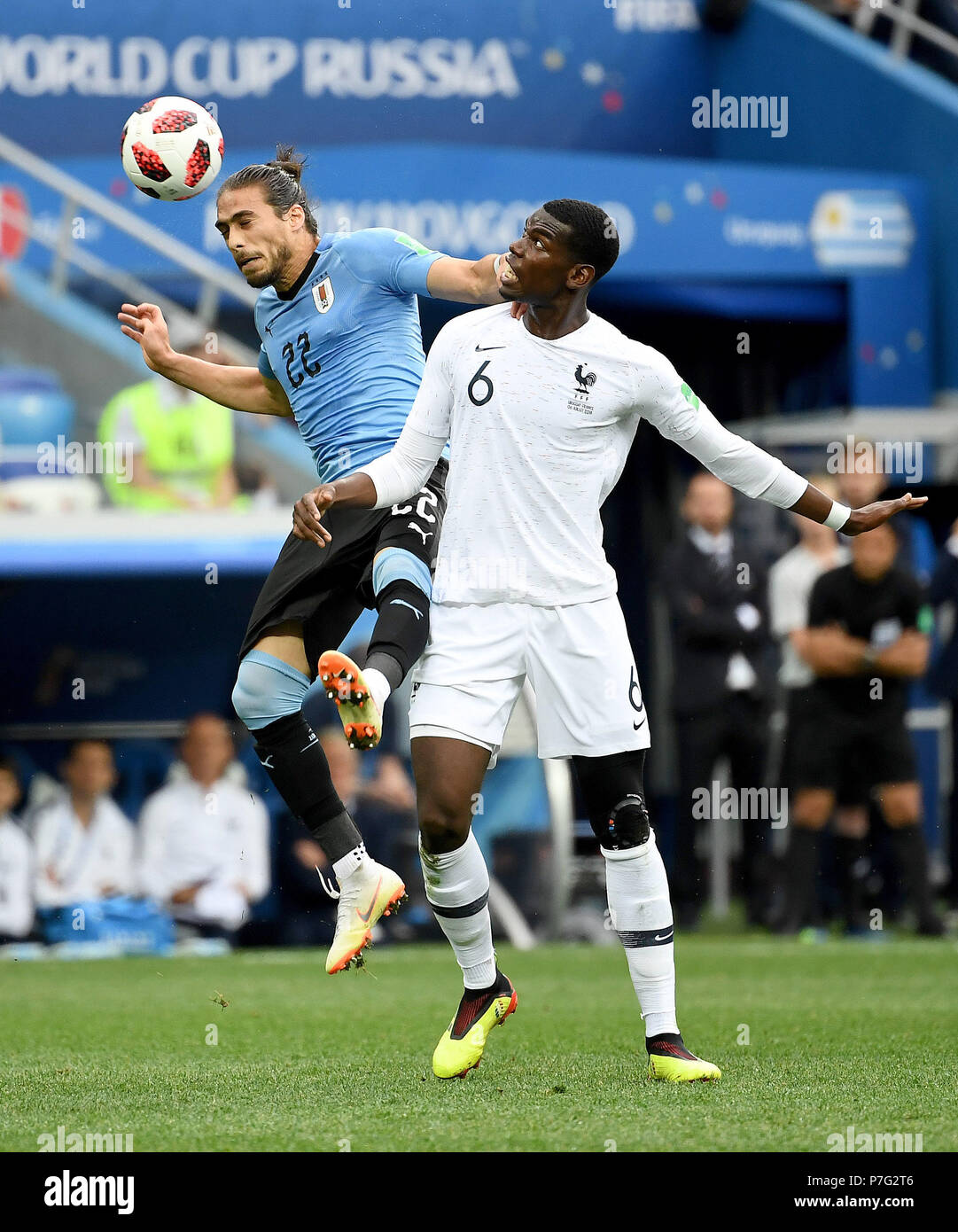 Nizhny Novgorod, Russia. 6th July, 2018. Martin Caceres (L) of Uruguay vies with Paul Pogba of France during the 2018 FIFA World Cup quarter-final match between Uruguay and France in Nizhny Novgorod, Russia, July 6, 2018. Credit: Chen Cheng/Xinhua/Alamy Live News Stock Photo