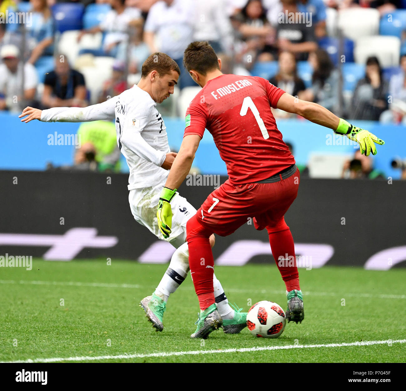 Nizhny Novgorod, Russia. 6th July, 2018. Goalkeeper Fernando Muslera (R) of Uruguay vies with Antoine Griezmann of France during the 2018 FIFA World Cup quarter-final match between Uruguay and France in Nizhny Novgorod, Russia, July 6, 2018. Credit: Liu Dawei/Xinhua/Alamy Live News Stock Photo
