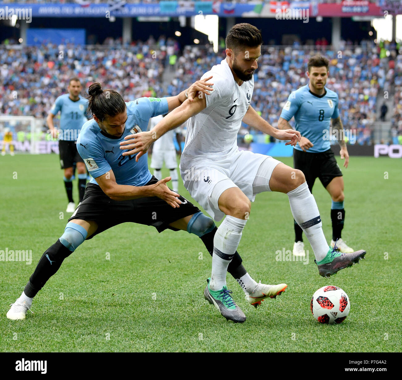 Nizhny Novgorod, Russia. 6th July, 2018. Martin Caceres (2nd L) of Uruguay vies with Olivier Giroud (2nd R) of France during the 2018 FIFA World Cup quarter-final match between Uruguay and France in Nizhny Novgorod, Russia, July 6, 2018. Credit: Chen Cheng/Xinhua/Alamy Live News Stock Photo