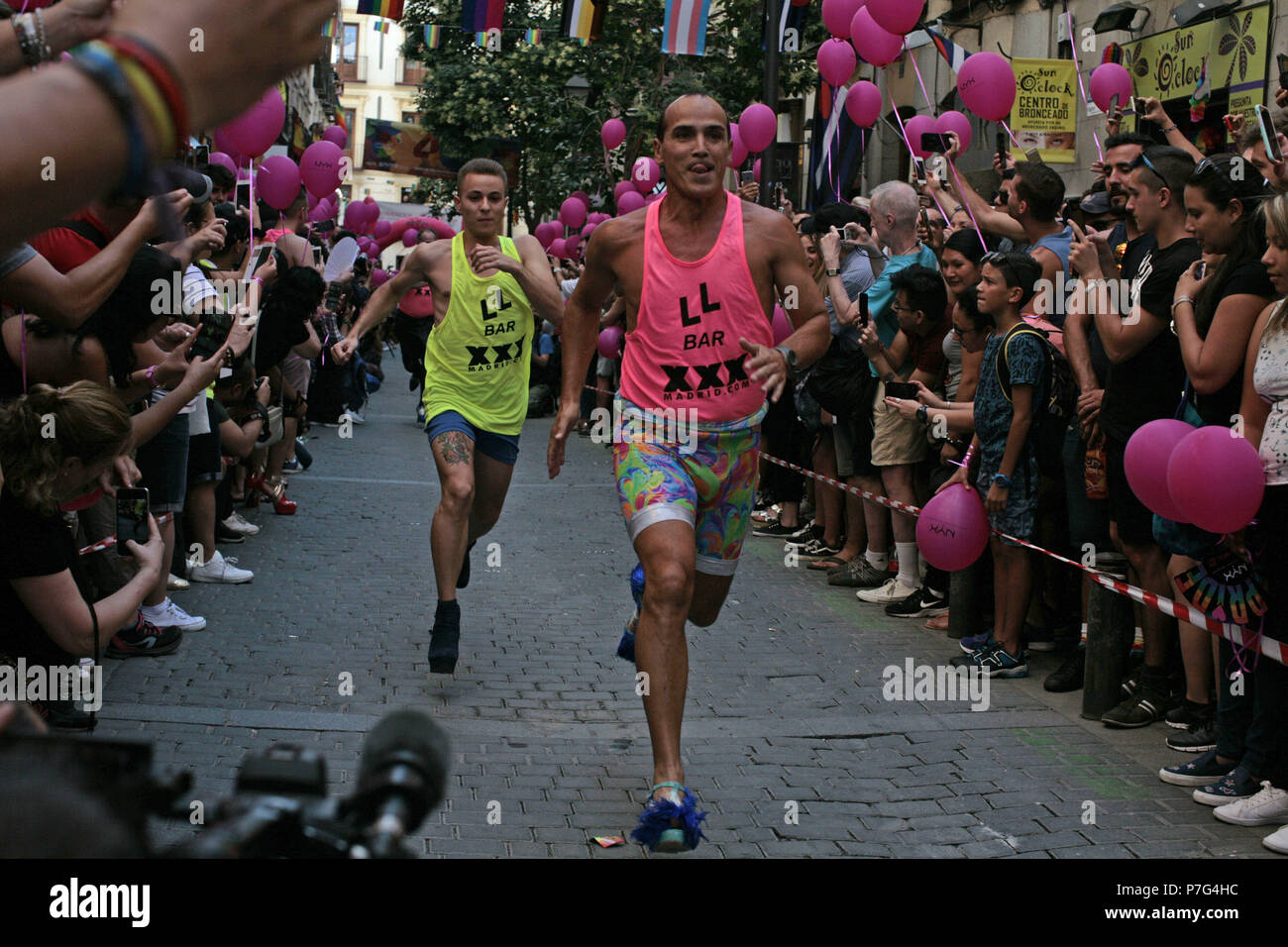 Madrid, Madrid, Spain. 5th July, 2018. Participants are seen running in  heels while the crowd cheers.The high heels race is one of the activities  that toke place during the LGBT gay pride