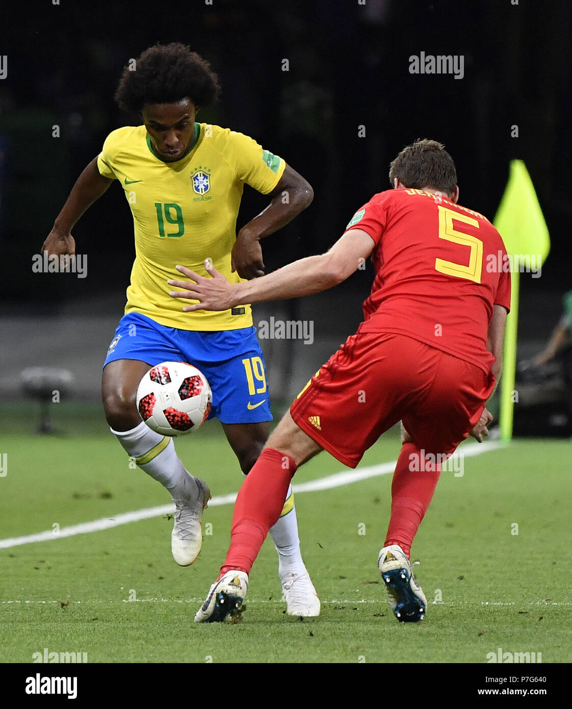 Kazan, Russia. 6th July, 2018. Willian (L) of Brazil vies with Jan Vertonghen of Belgium during the 2018 FIFA World Cup quarter-final match between Brazil and Belgium in Kazan, Russia, July 6, 2018. Credit: He Canling/Xinhua/Alamy Live News Stock Photo