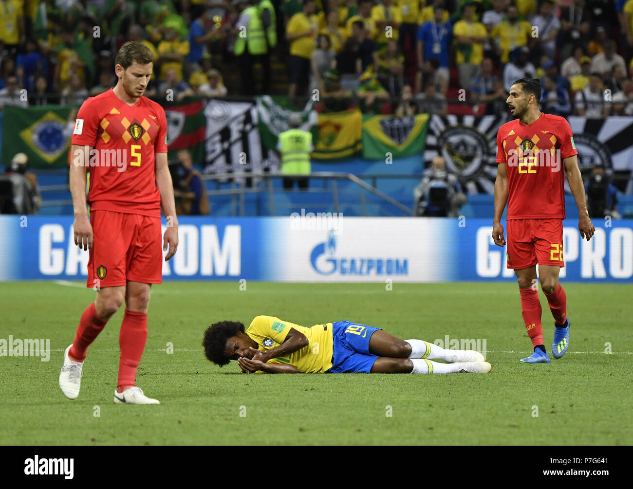 Kazan, Russia. 6th July, 2018. Willian (bottom) of Brazil lies on the pitch after his injury during the 2018 FIFA World Cup quarter-final match between Brazil and Belgium in Kazan, Russia, July 6, 2018. Credit: He Canling/Xinhua/Alamy Live News Stock Photo