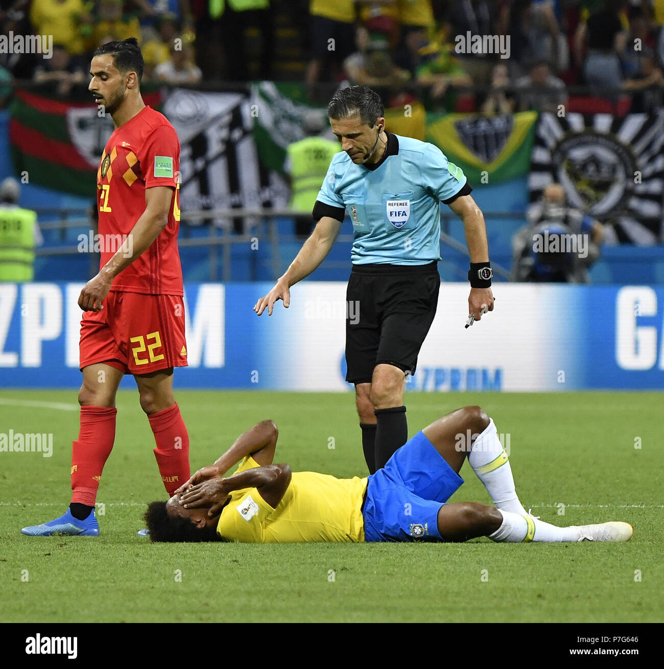 Kazan, Russia. 6th July, 2018. Willian (bottom) of Brazil lies on the pitch after his injury during the 2018 FIFA World Cup quarter-final match between Brazil and Belgium in Kazan, Russia, July 6, 2018. Credit: He Canling/Xinhua/Alamy Live News Stock Photo