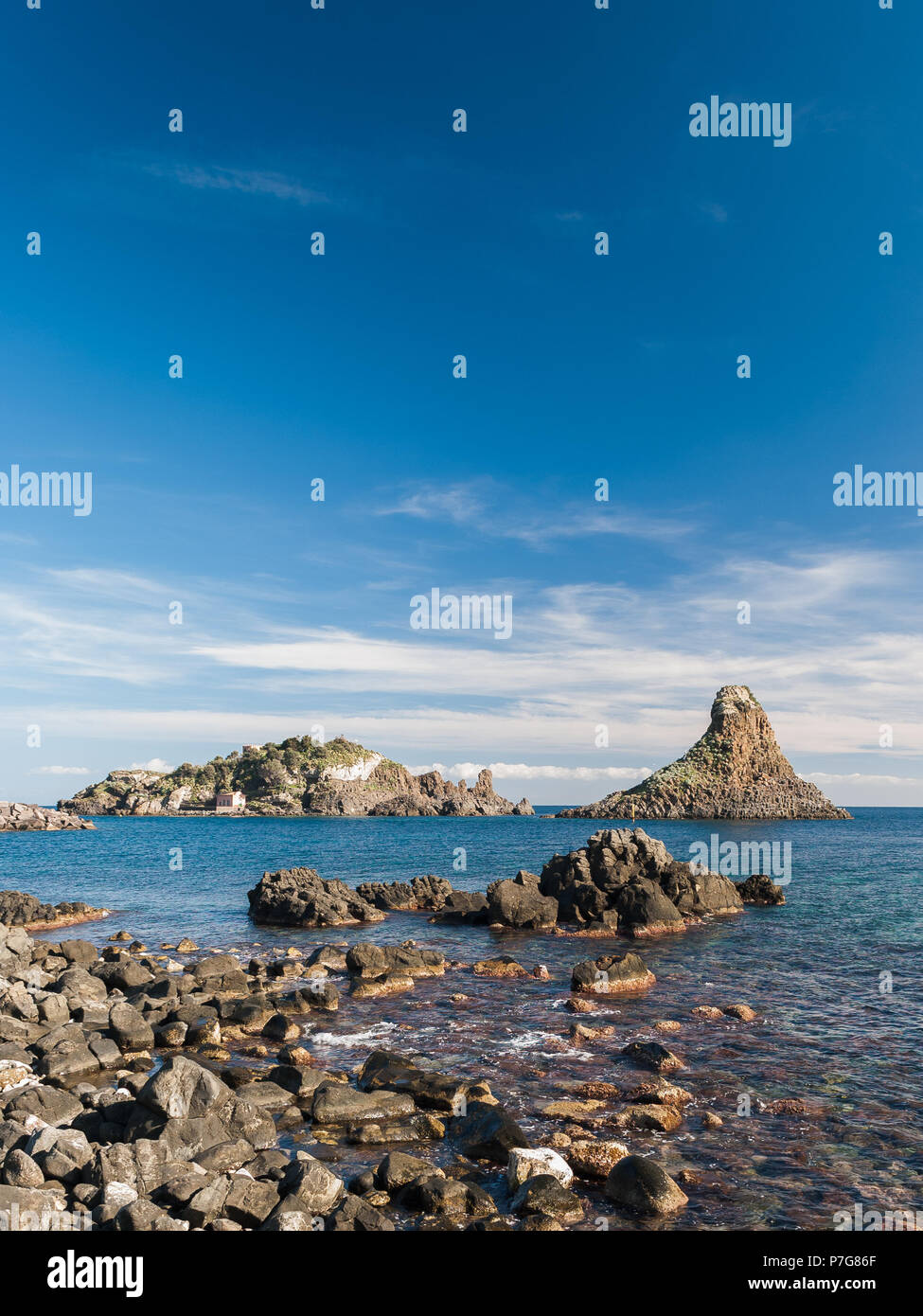 Island Lachea and a sea stack, geological features in Acitrezza (Sicily) Stock Photo