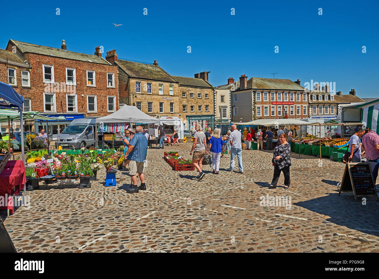 Ornate buildings line the market square in the centre of the North Yorkshire market town of Richmond. Stock Photo