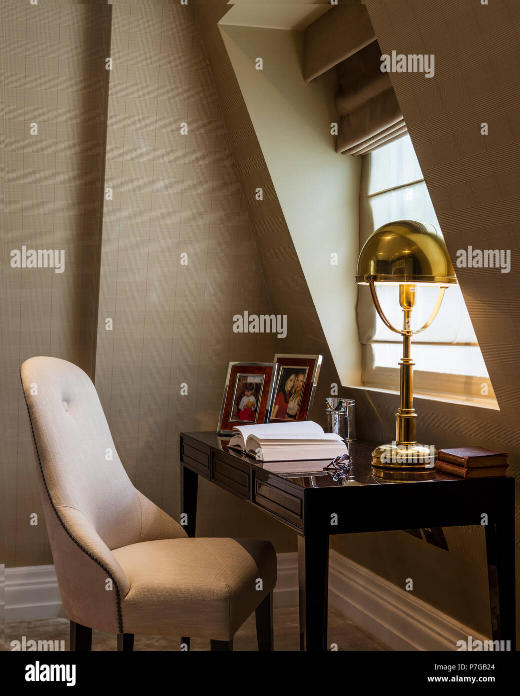 Desk and chair under window Stock Photo Alamy