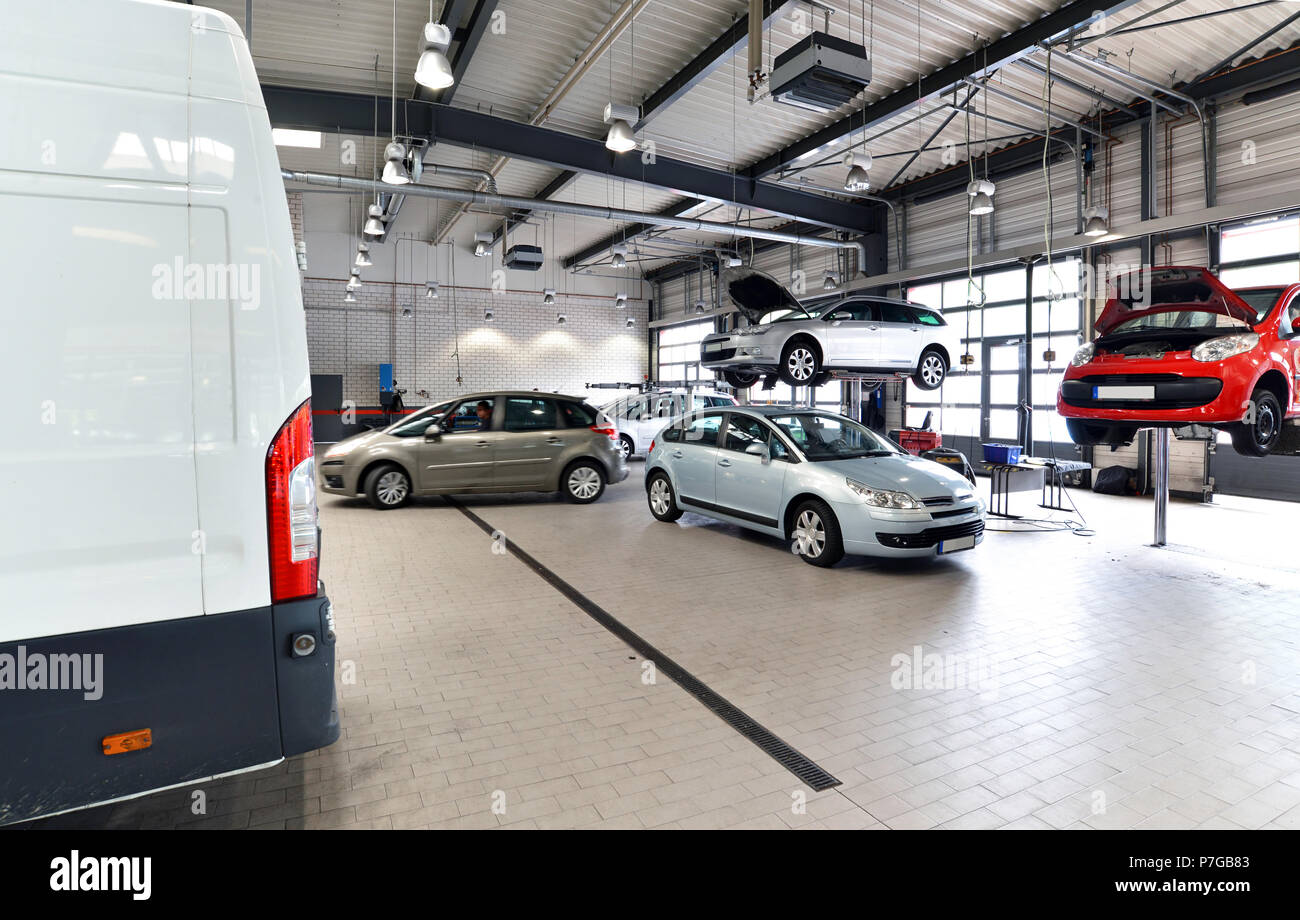 Industrial interior of a vehicle repair station hi-res stock