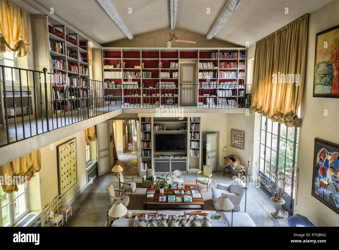 Modernised double height mezzanine library in 18th century chateaux, St Remy de Provence Stock Photo
