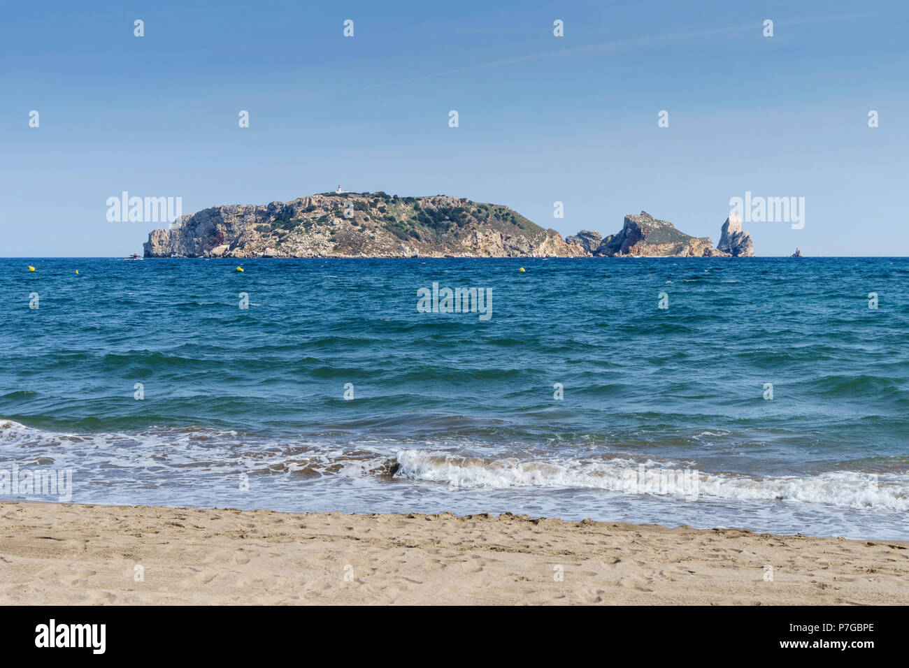 Girona, region of, Catalonia northern Spain - L'Estartit, holday resort beach. Medes Islands just offshore, La Meda. With lighthouse, Phar de la Meda. Stock Photo