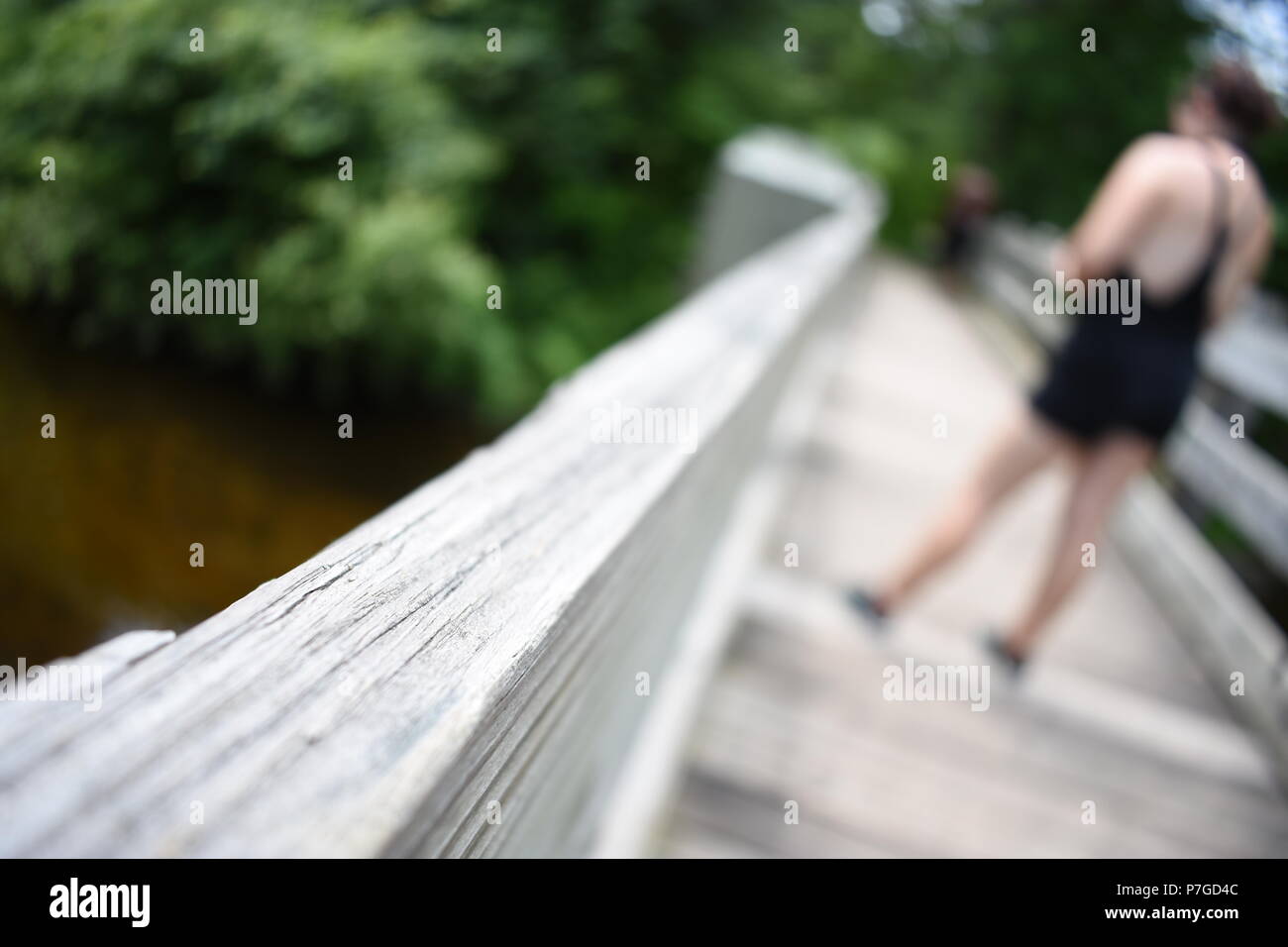 Girl On A Bridge Stock Photo
