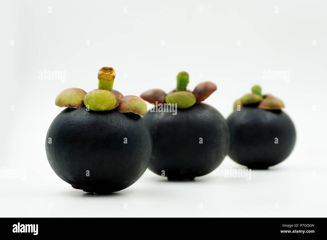 Group of mangosteen fruit isolated on white background. Mangosteens is