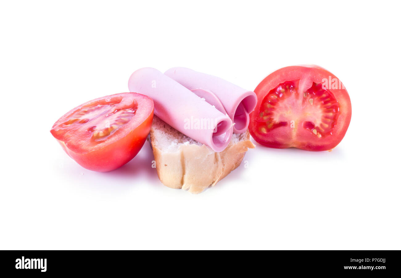 Sandwich with ham on a piece of white bread and a tomato Stock Photo