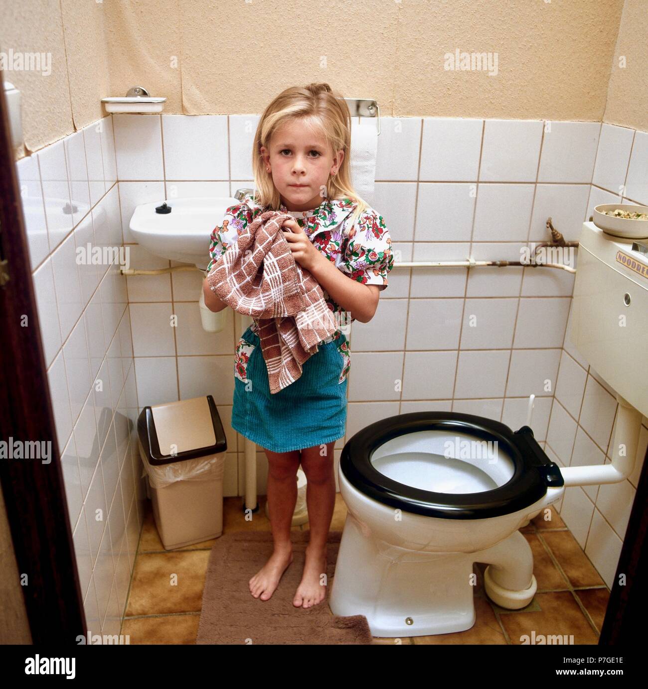 100-005-017 Little girl washing hands after bathroom use Stock Photo