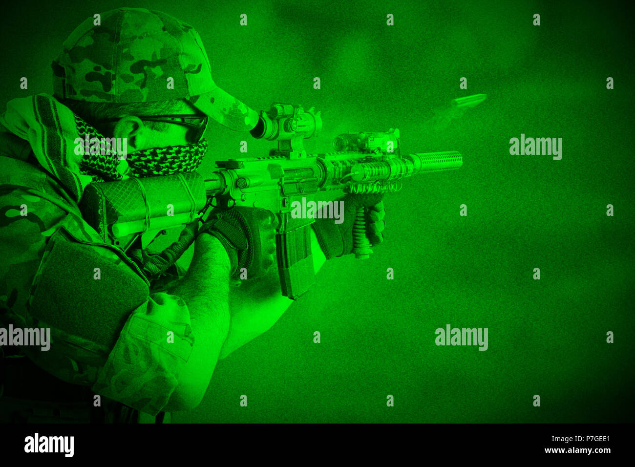 Private Military Company soldier with assault rifle. View through night vision Stock Photo