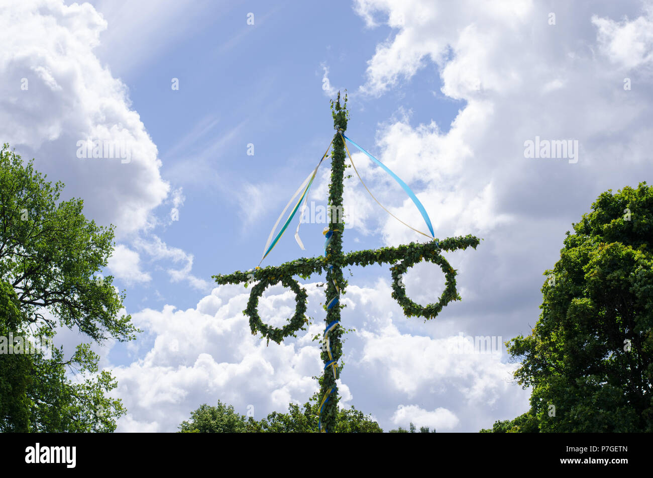 A midsummer pole has been raised for the festivities. Stock Photo