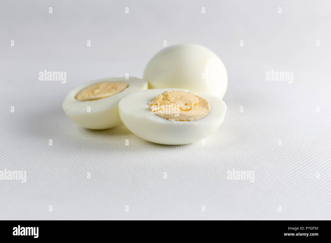 Boiled Eggs Cut in Half On White Background Isolated Stock Photo