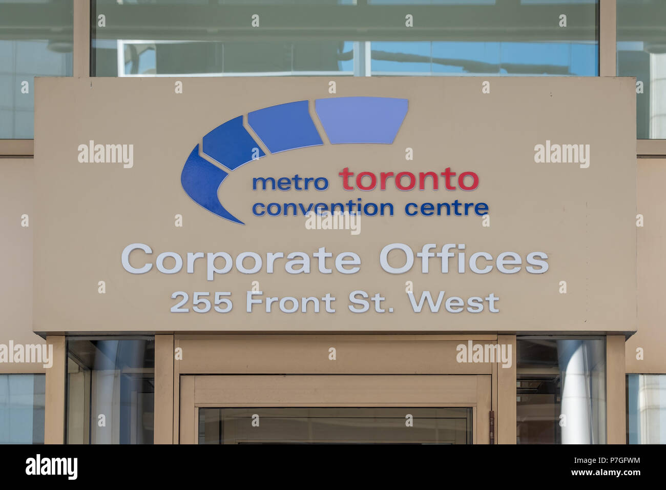 Sign over the front doors of the Corporate Offices of the Metro Toronto Convention Centre. Stock Photo