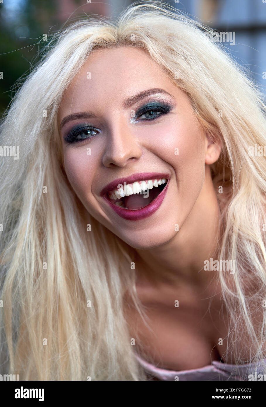 Close-up portrait of the beautiful smiling young girl Stock Photo - Alamy