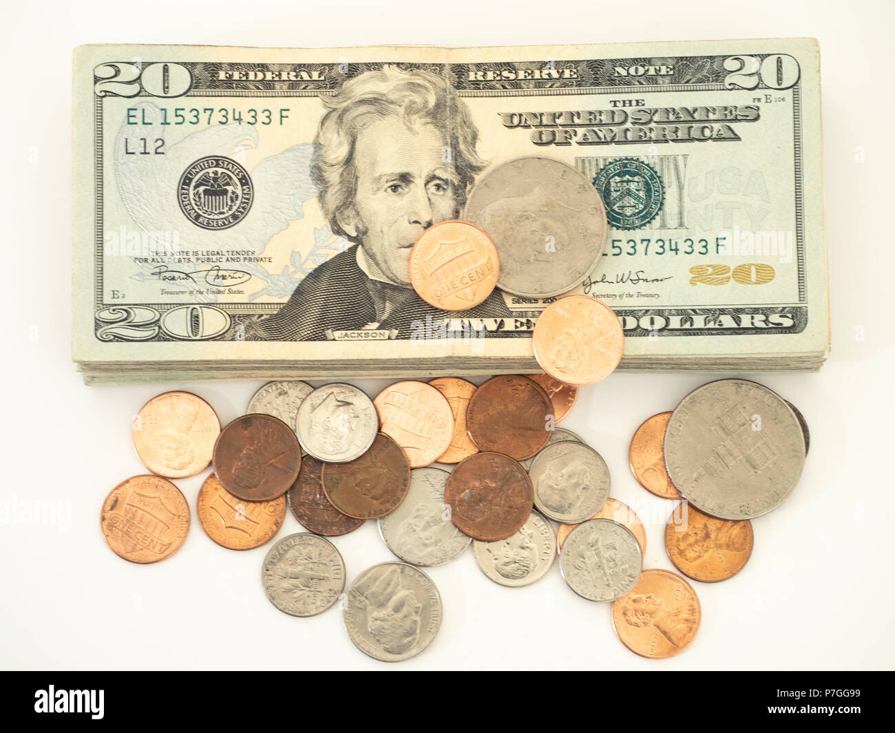 a stack of twenty dollar bills with loose coins. The US currency is