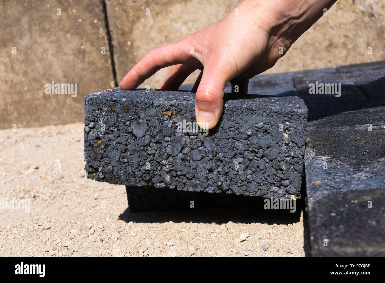worker-laying-concrete-pavement-onto-the-sand-stock-photo-alamy